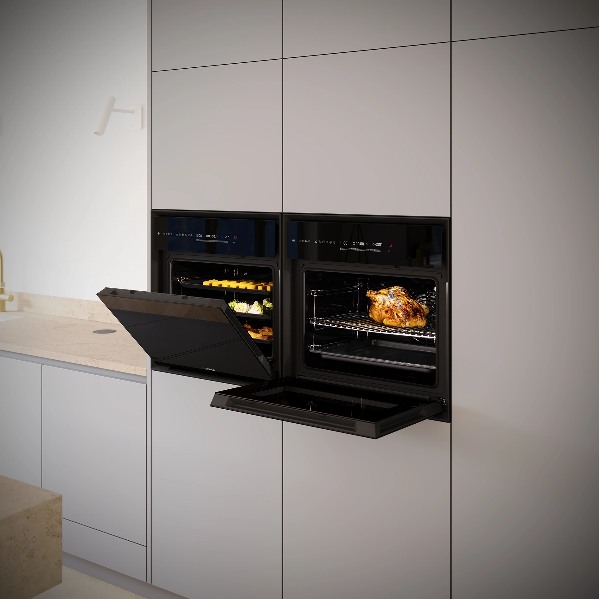 Twee BORA Oven Steam stoomovens met geopende deuren ingebouwd in een lichte greeploze keuken