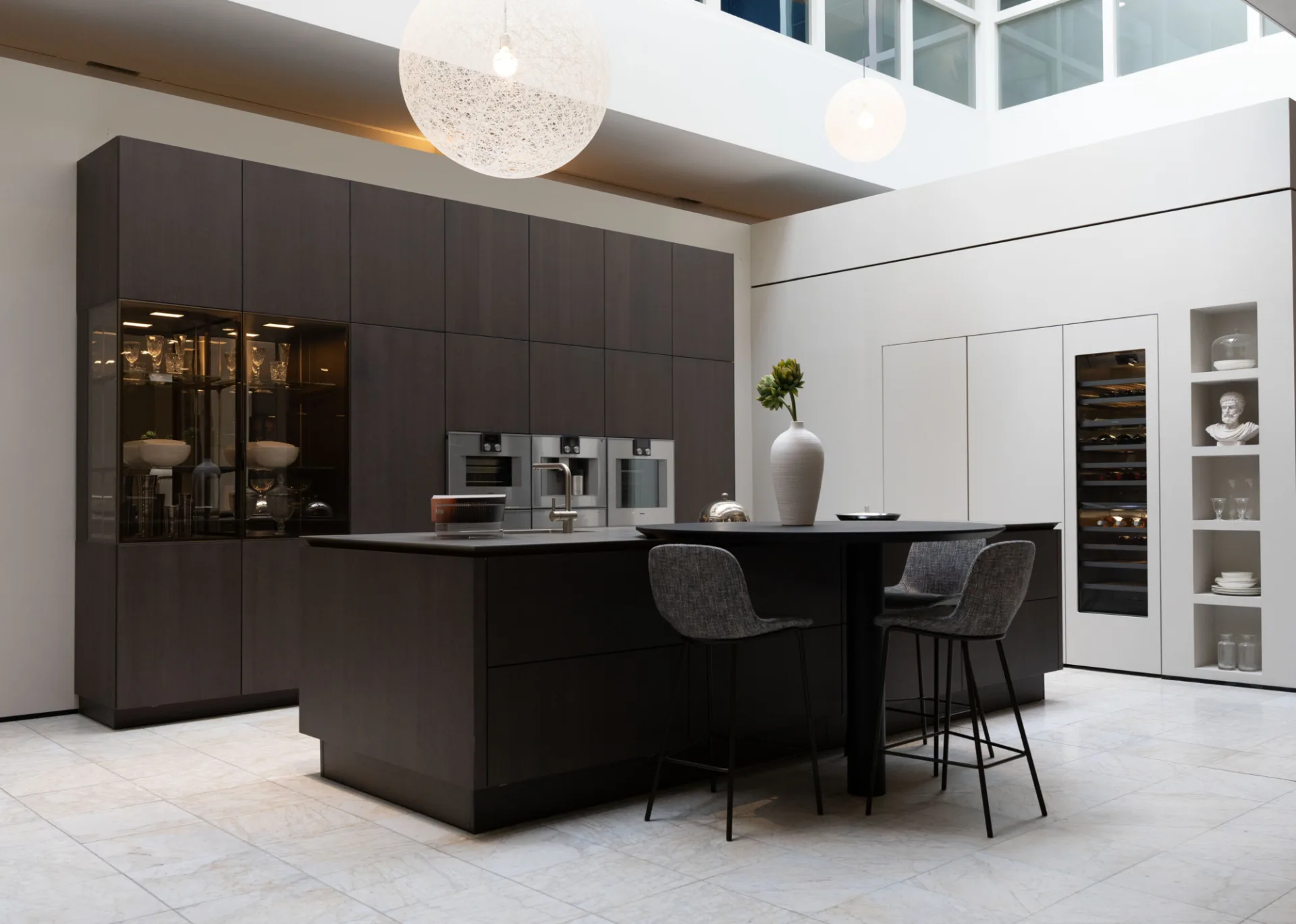 SieMatic kitchen designed by ASWA Kitchens featuring a cooking island and luxury custom work.