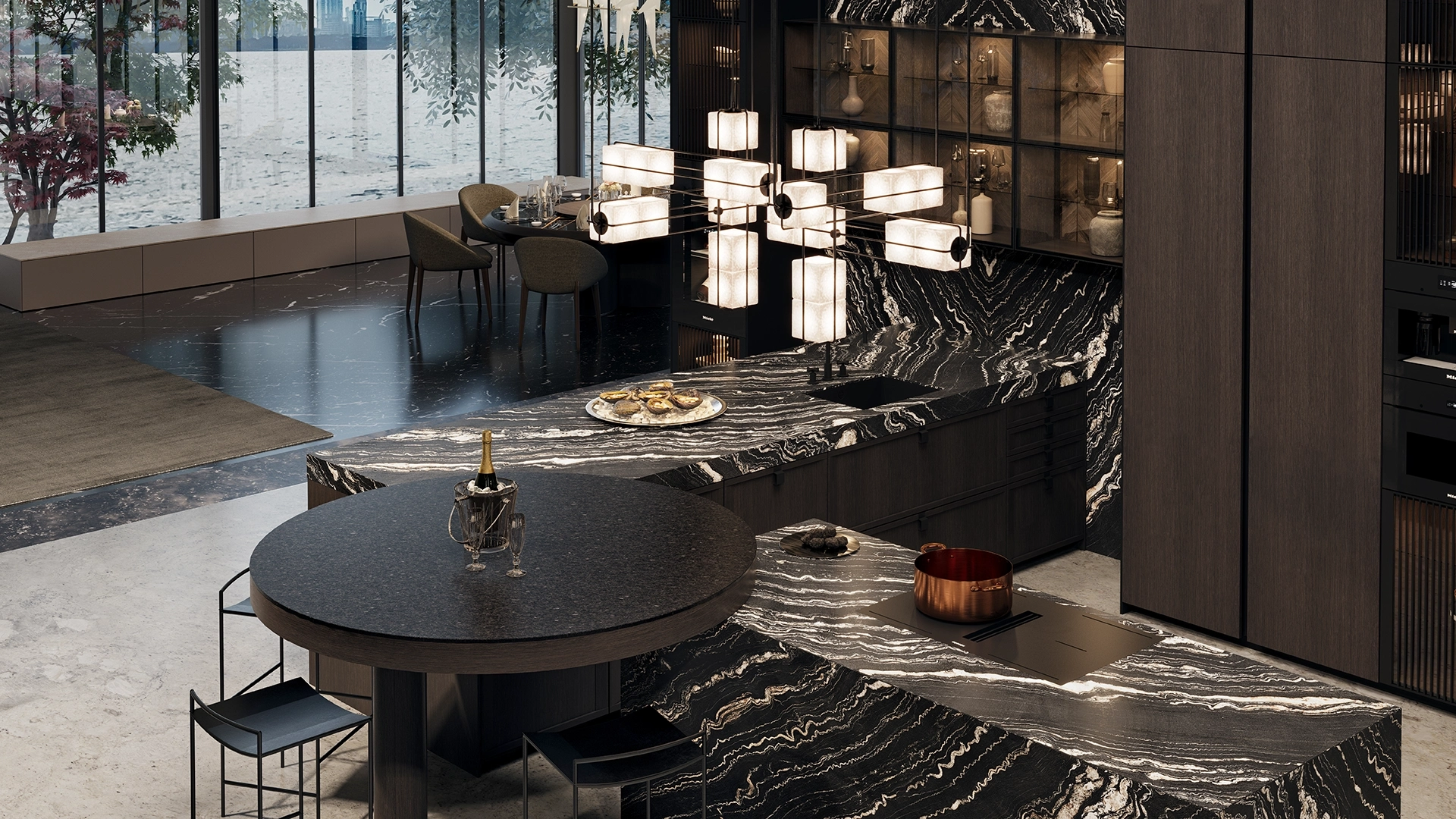 SieMatic MONDIAL designkeuken met natuurstenen kookeiland, ronde tafel en luxe materiaalgebruik.