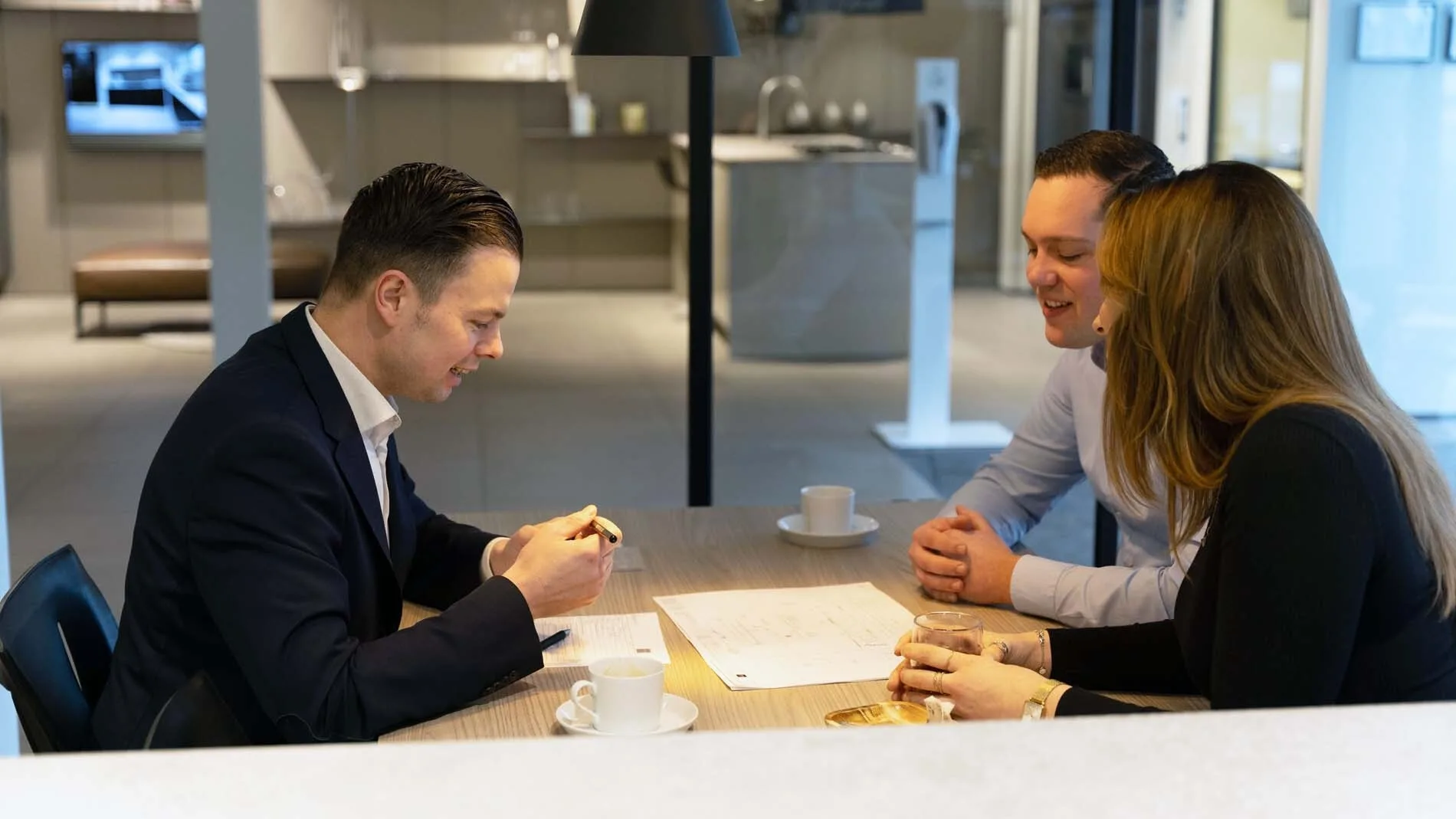 Introductory consultation with a kitchen consultant in the showroom for a custom kitchen design.